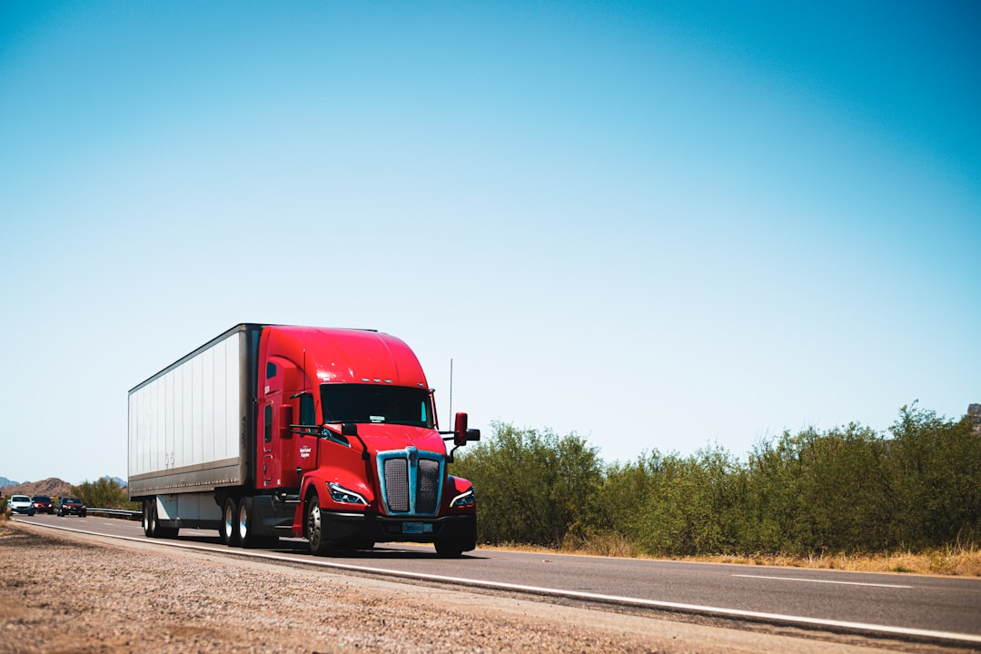 Semi truck on a highway representing Aurora driverless trucks hauling freight safely