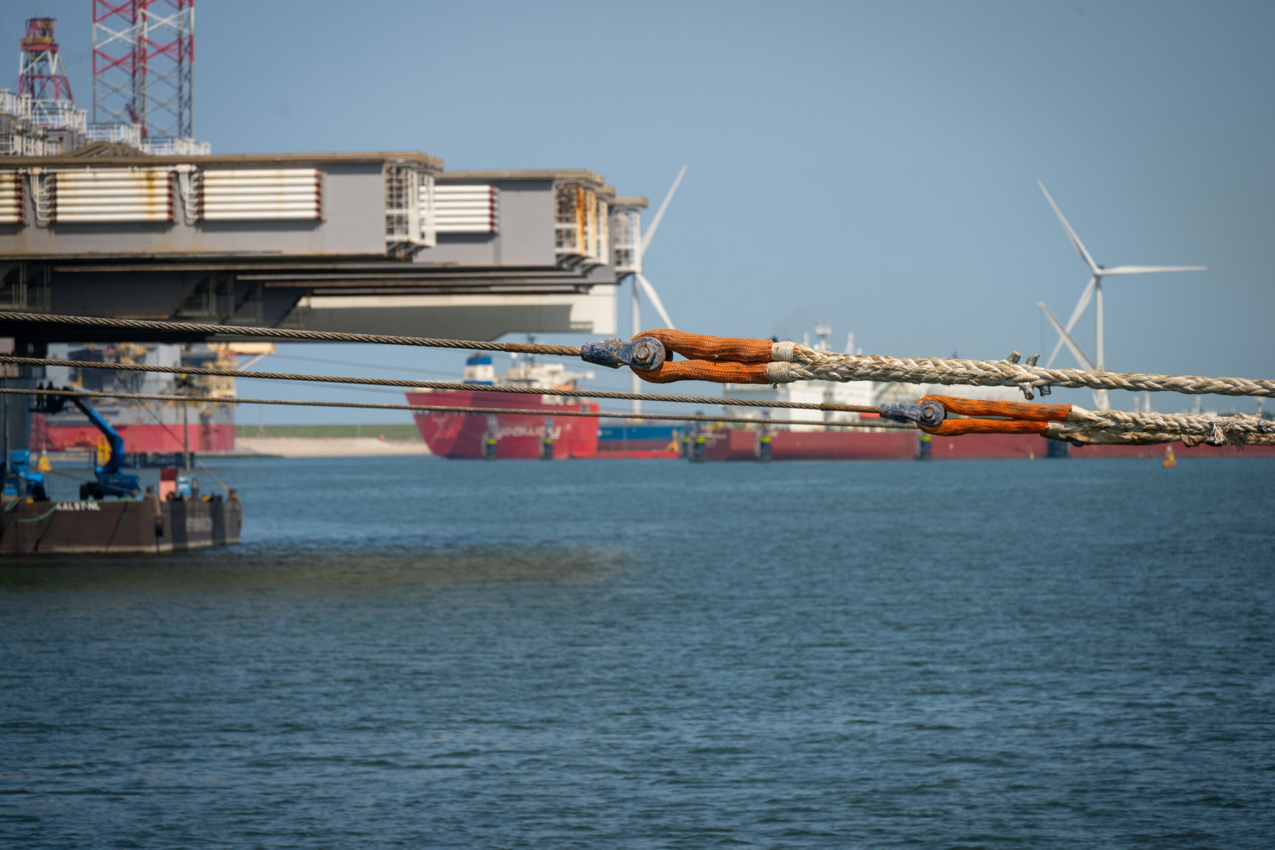 Industrial port with large floating structures, symbolizing Newcleo's floating nuclear reactor concept