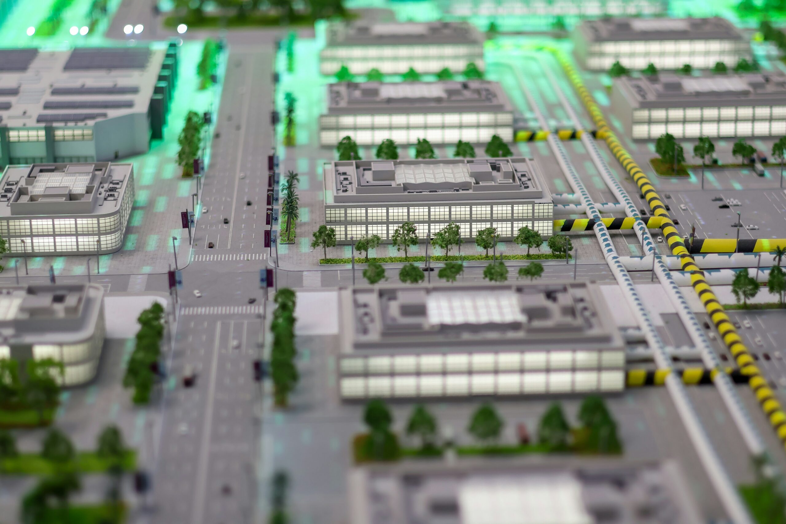 Illuminated smart city model representing AI permitting technology transforming urban planning