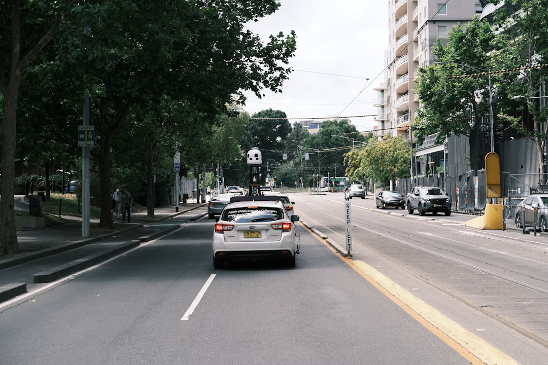 Self-driving car on a city street, reflecting Waymo Ojai accessibility gains for riders