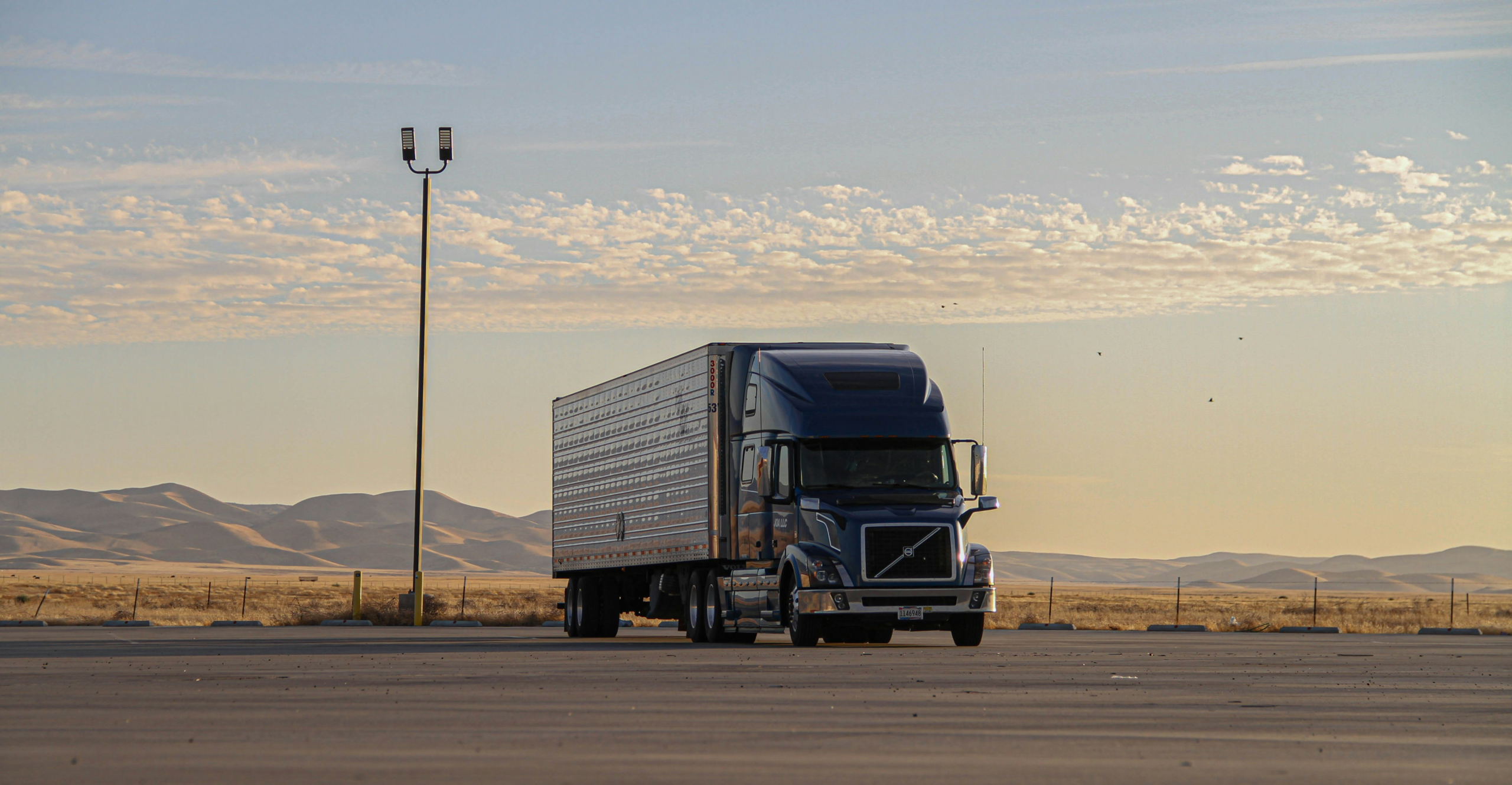 A self-driving semi truck on the highway, illustrating autonomous trucking safety technology