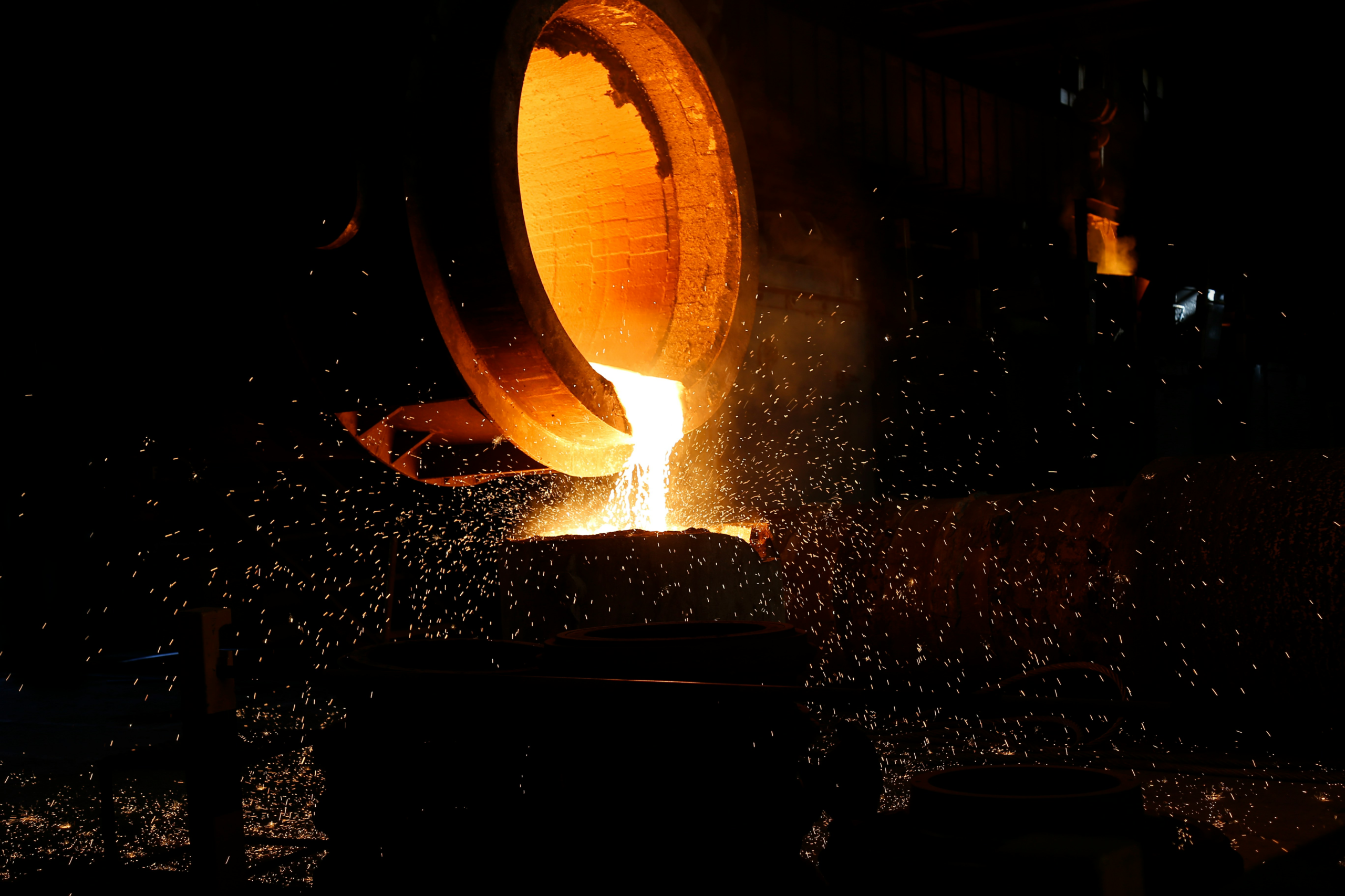 Molten metal pouring in an industrial setting, symbolizing the Blykalla SEALER lead-cooled reactor design