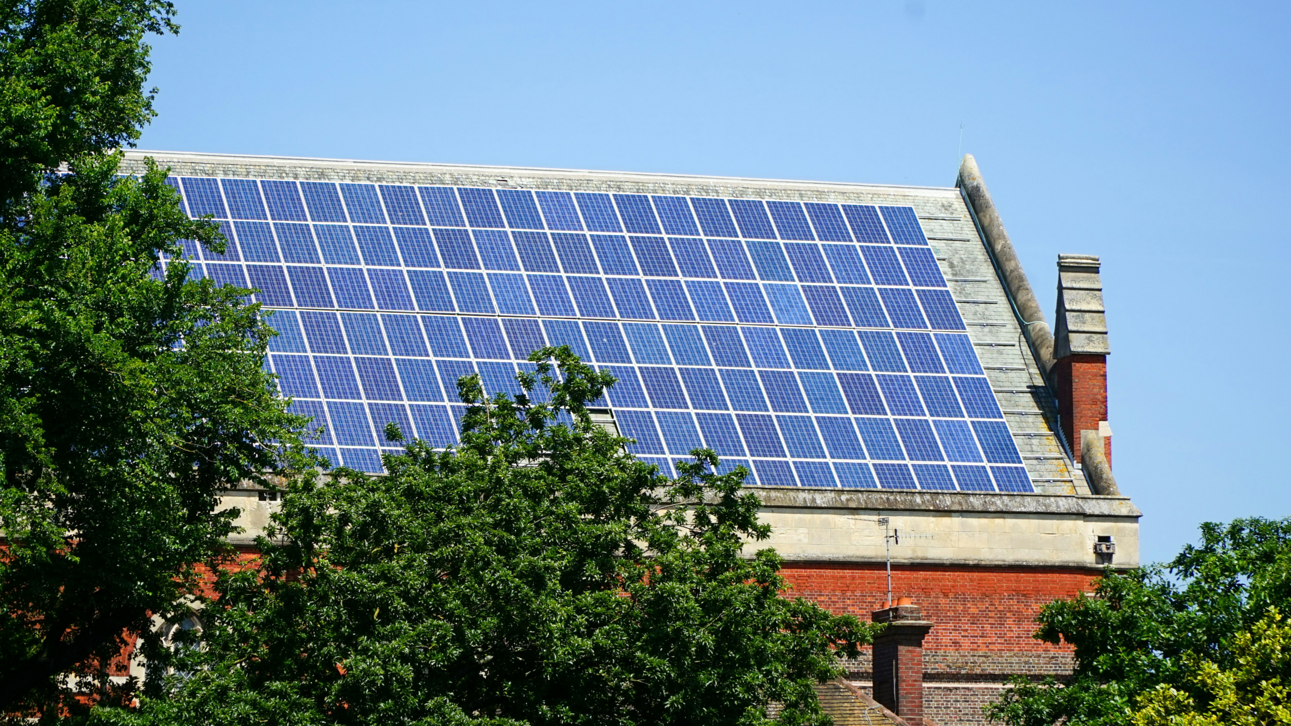 Rooftop solar panel array similar to the one funding community solar bill credits in Everett