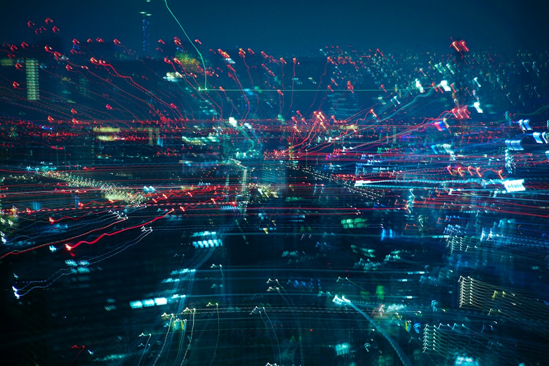 Aerial night view of a connected city skyline, echoing how the DC Compass AI chatbot maps city data for residents