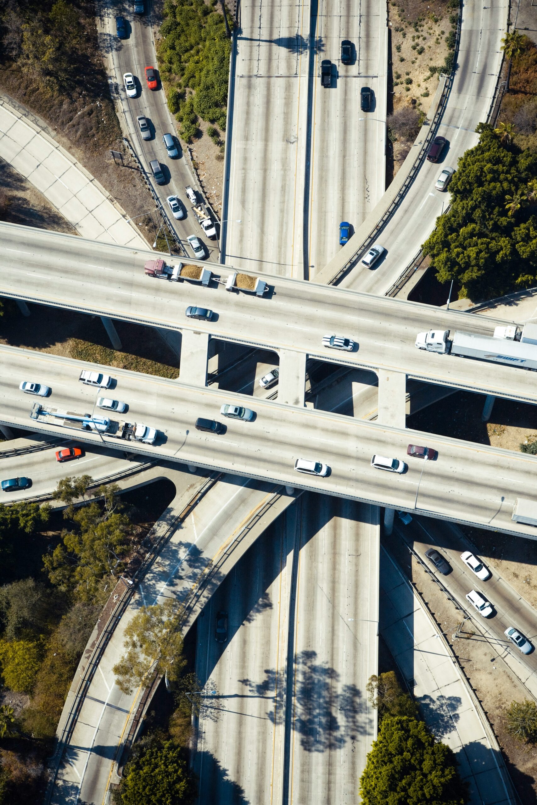 Multi-lane freeway interchange representing Waymo's Austin freeway rides expansion