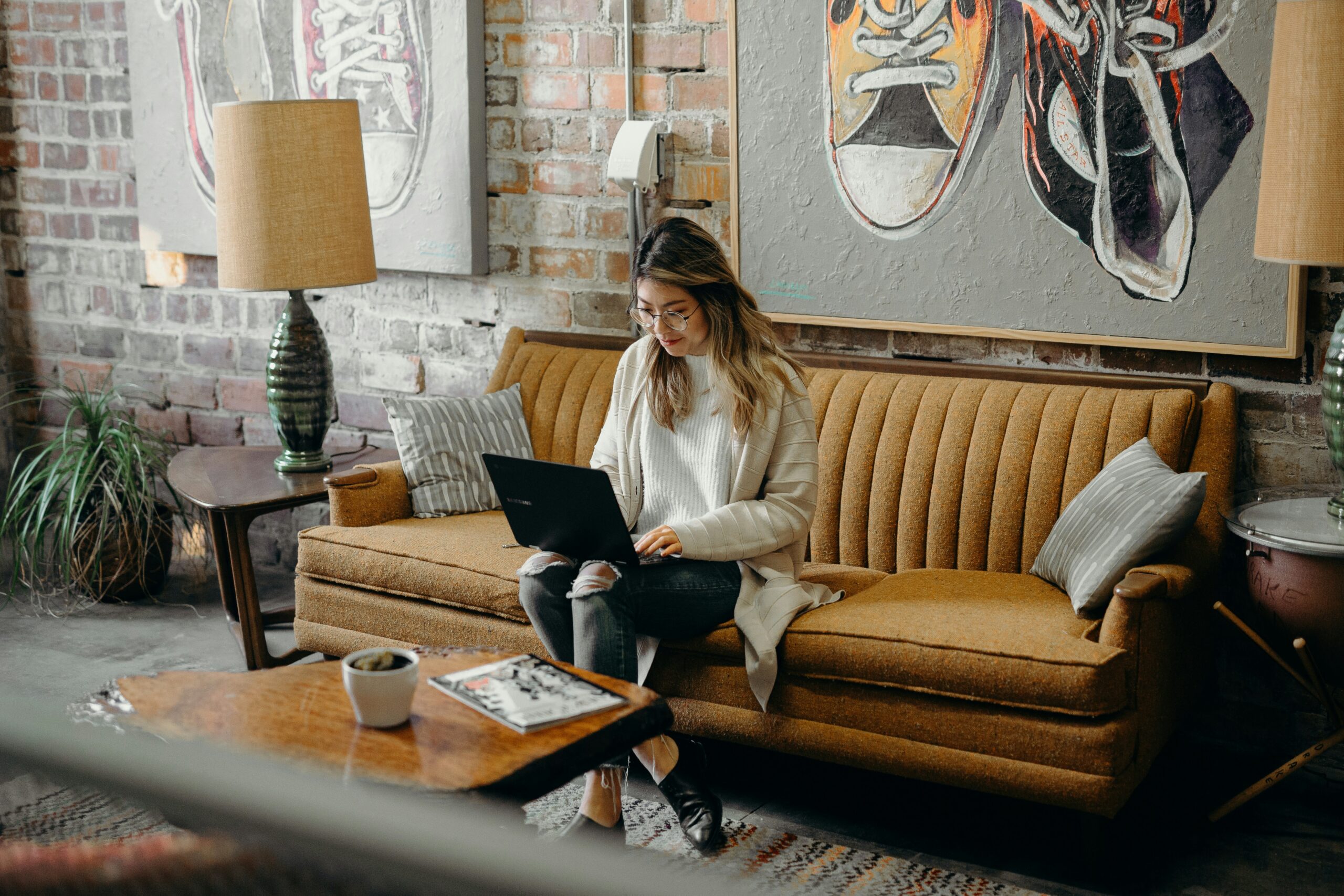 Person using a laptop online, representing the Kansas unemployment AI system that speeds benefit claims for workers