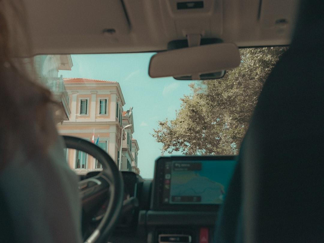 Car driving through a European city street, evoking the new London robotaxi service now carrying Uber riders