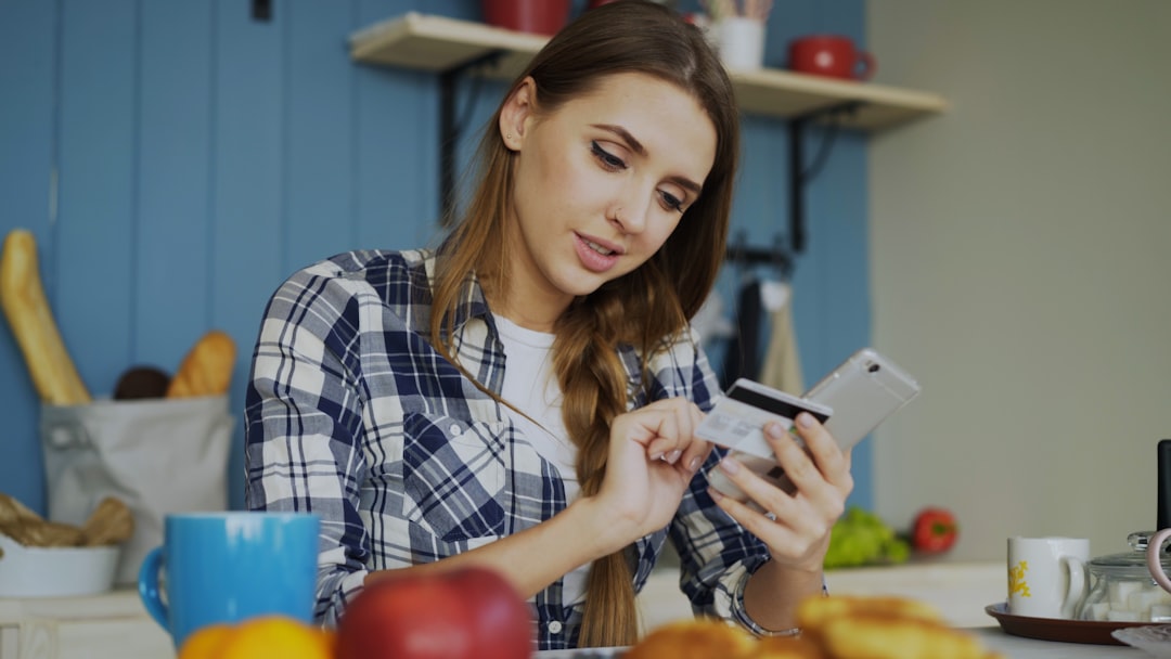 Woman using smartphone at home, representing how the Meta Muse AI agent simplifies daily tasks