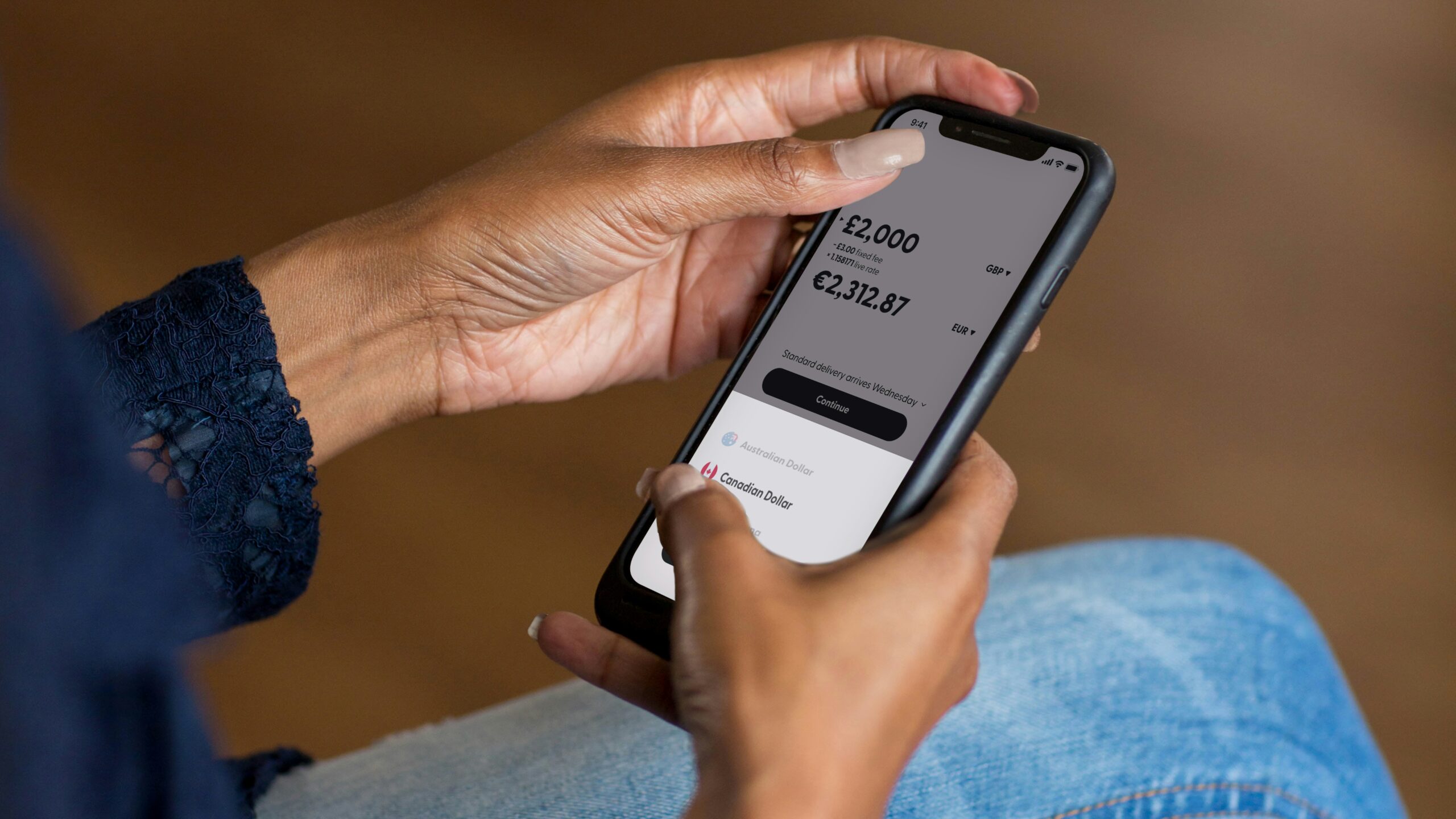 Hands holding a smartphone using a banking app, symbolizing a Nu Global stablecoin account