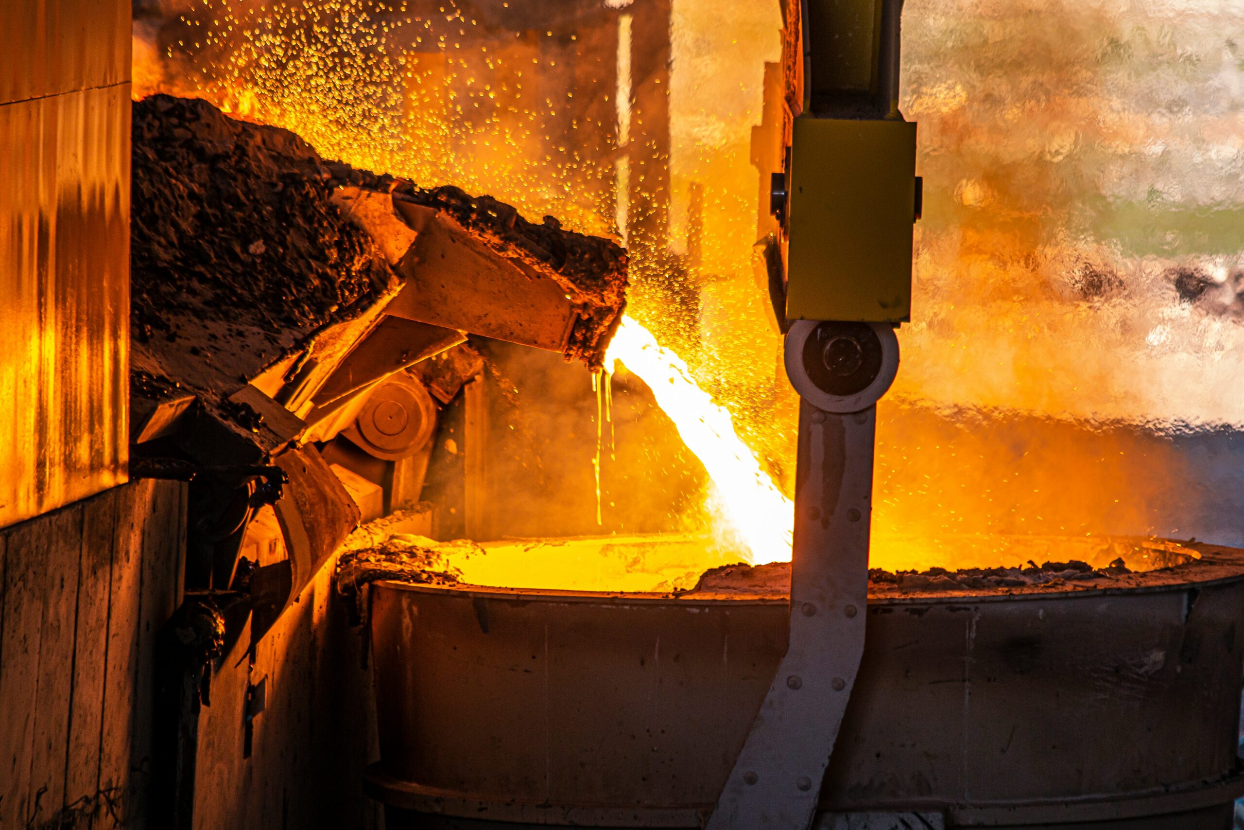 Molten metal pouring from a furnace, representing the Saltfoss molten salt reactor fuel partnership with KAERI