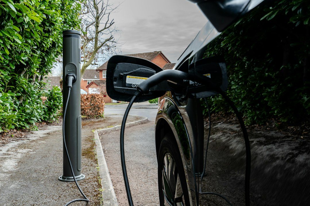 Curbside EV charger mounted on a city street, illustrating NYC's new curbside EV charging network