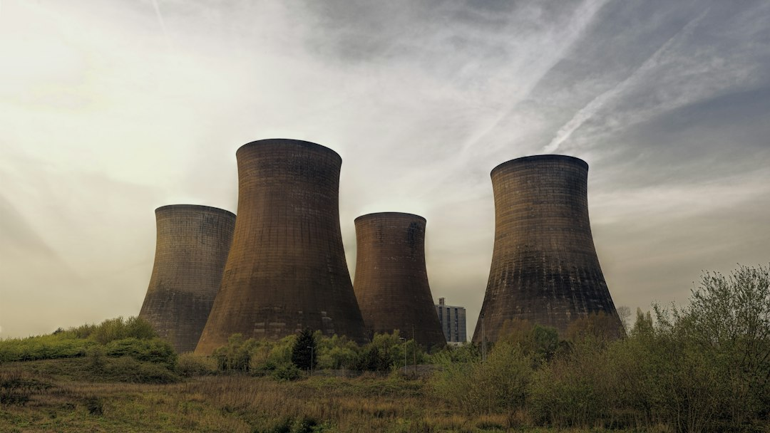 Cooling towers of a nuclear power plant, symbolizing reactor safety advances like NuScale safety pellets