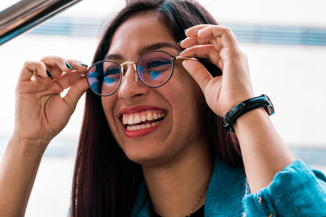 Person wearing smart glasses, representing how RayNeo iO glasses caption conversations in real time