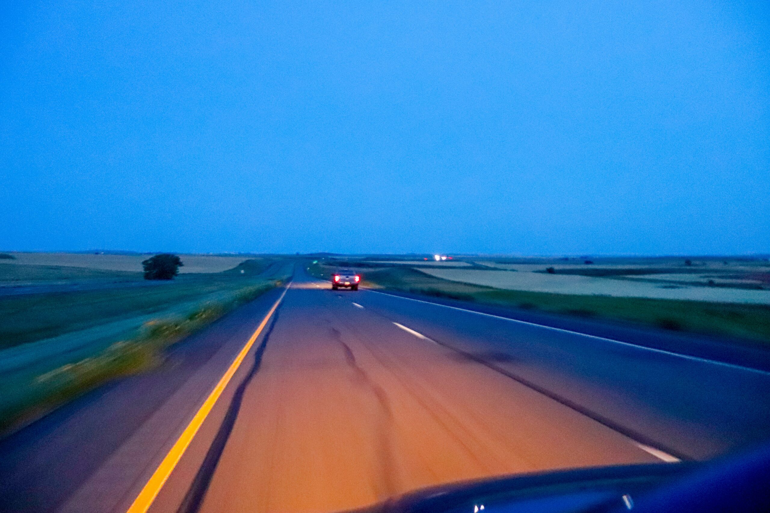 Empty rural interstate highway at dawn, symbolizing new self-driving rural access under a federal strategy