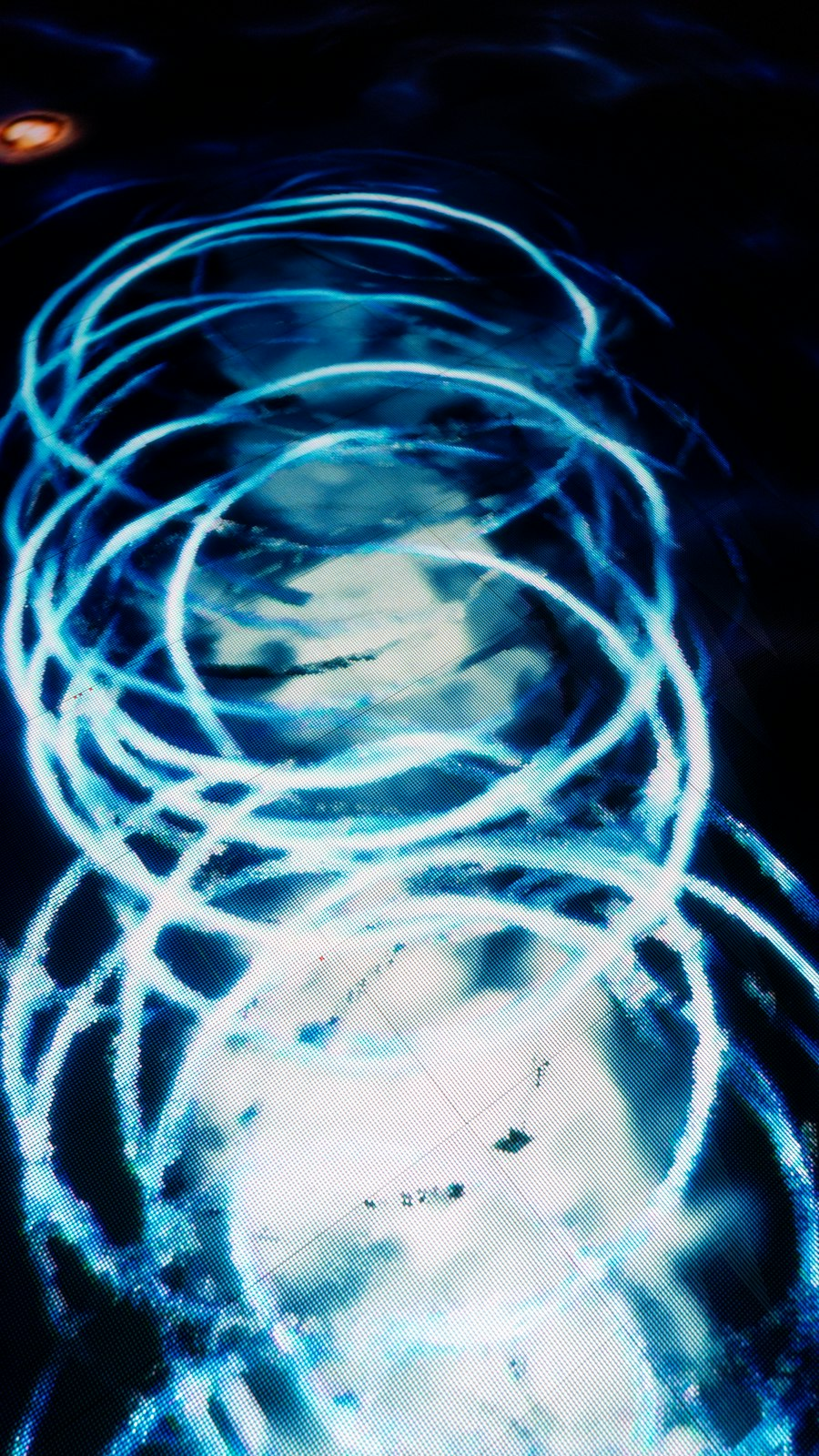 Abstract blue light swirls representing emerging technology