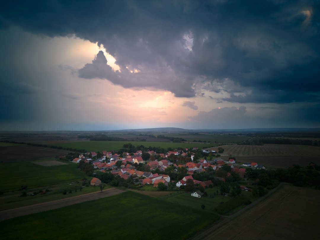 Storm clouds gather over a small rural town, the scenario Emanuel County emergency alerts are built to warn residents about.