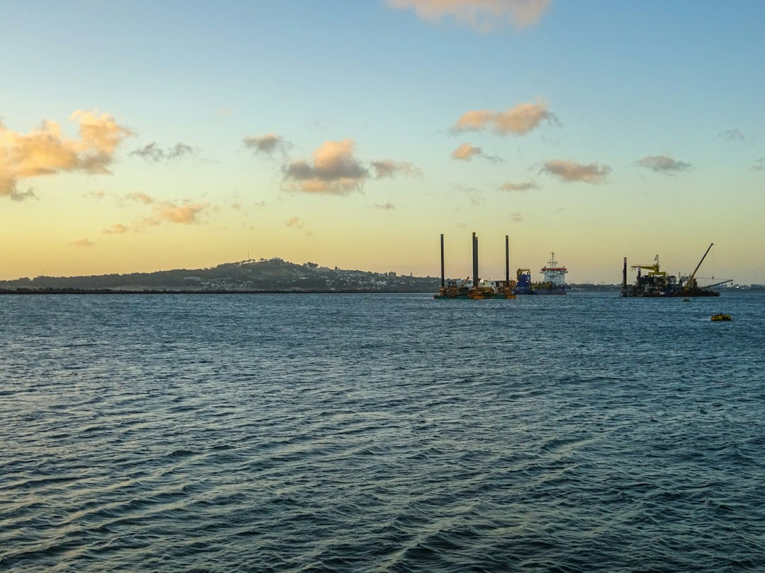 Industrial barge at a port, symbolizing the transportable BWXT BANR microreactor plant delivered by sea
