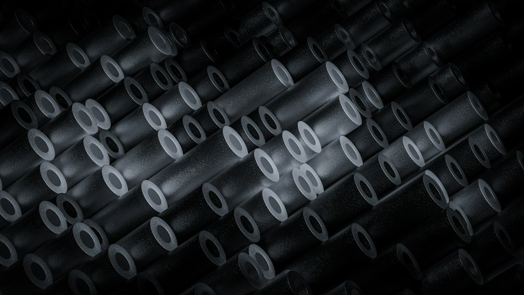 Abstract close-up of hollow metal cylinders representing nuclear fuel cladding imaging research